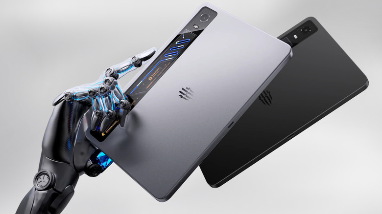 The RedMagic Astra 2 tablet in black and white, the latter held by a robotic hand