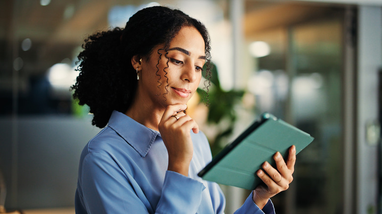 Person using tablet in workplace