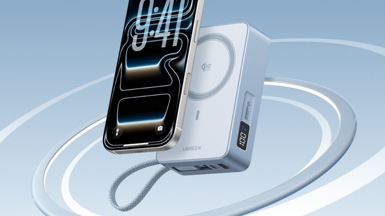 A Ugreen MagFlow Qi2 25W Magnetic Power Bank with an iPhone