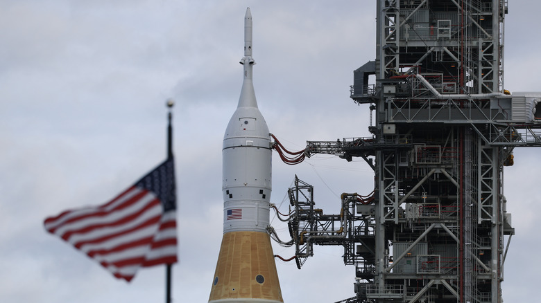 close-up view of tip of Artemis II space rocket as it is attached to the ground control system