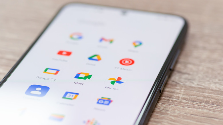 Android smartphone showing various application icons on the screen