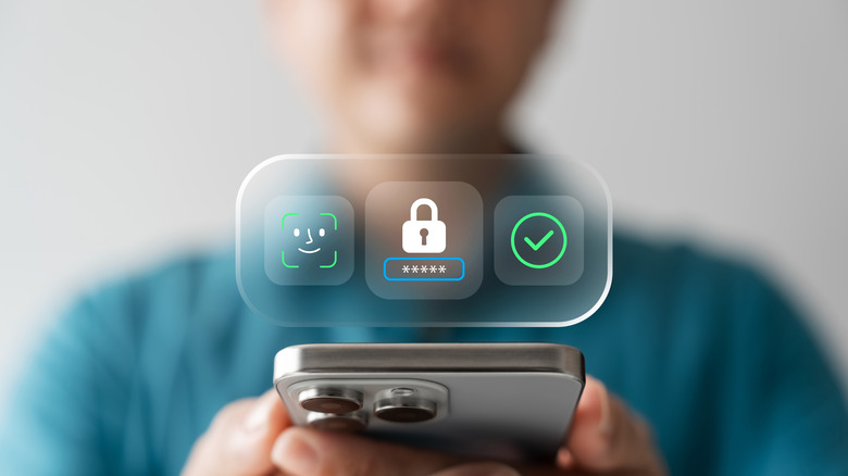 face ID / face unlock concept. iphone showing symbols for security and face unlock above the phone