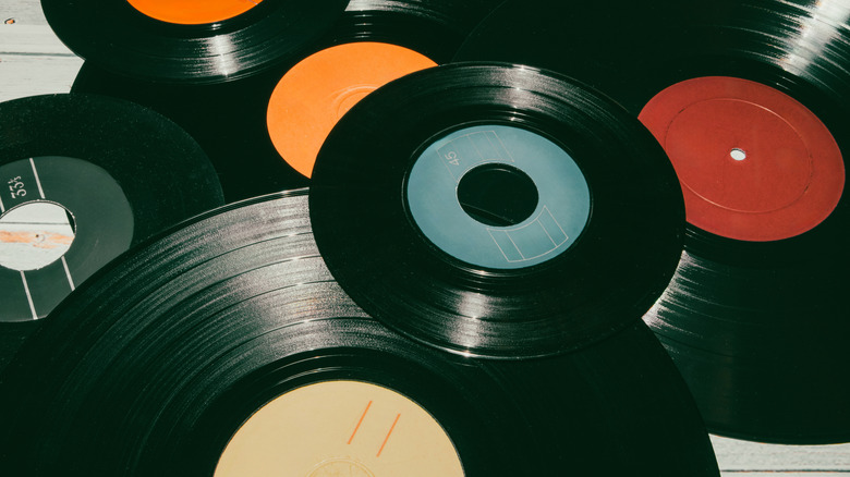 Pile of vinyl records laying on tile