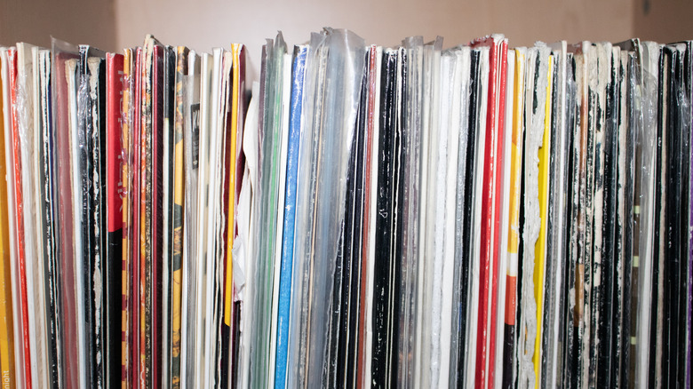 Vinyl records on shelf, ranging in colors