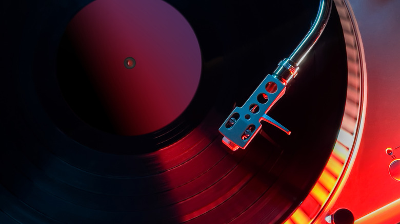 Turntable photographed from above showing arm and needle playing record as it spins