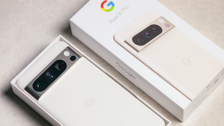 Google Pixel 8 next to its packaging.