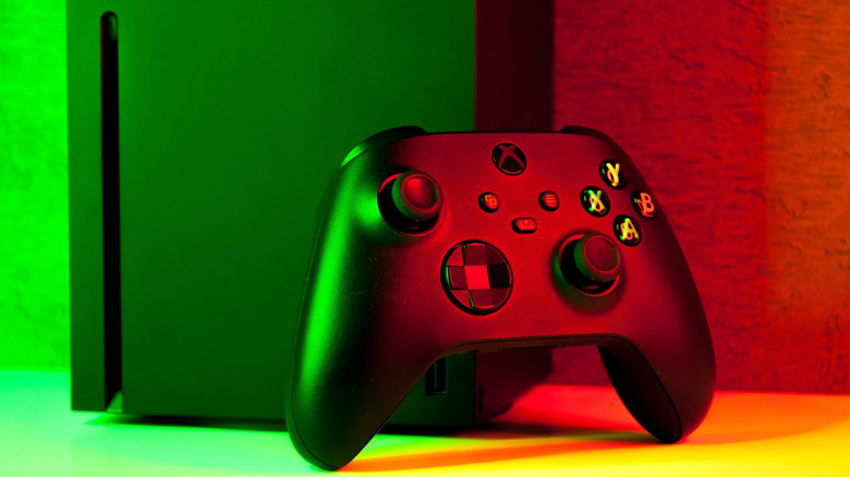A close up of an Xbox controller and the bottom of an Xbox Series X
