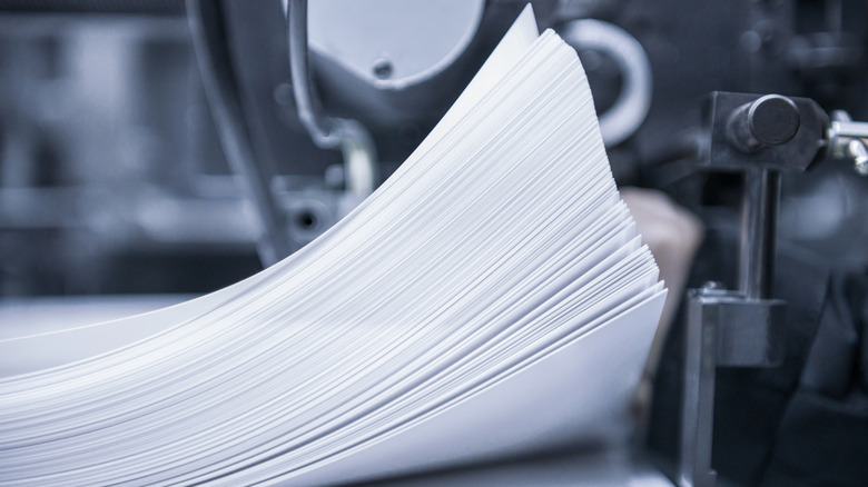 Ream of paper inside of an industrial printer