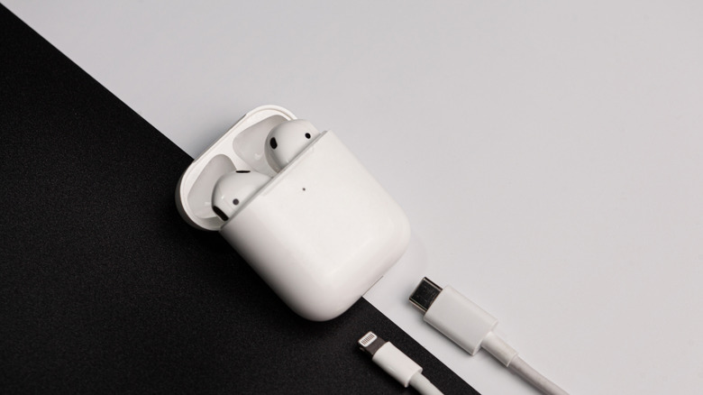 airpods in case with chargers visible.