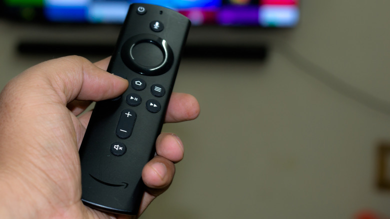 Amazon Fire TV remote in hand