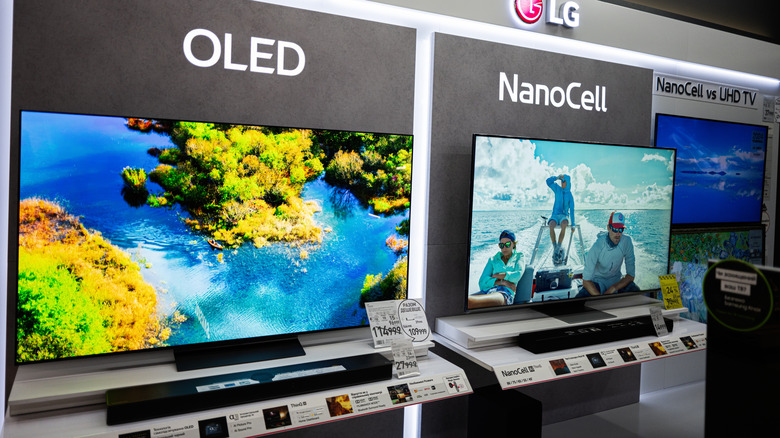 OLED and NanoCell TVs displayed side by side in an electronics store.