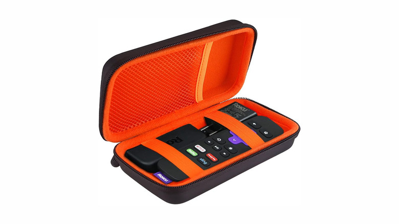 A carrying case with a Roku Streaming Stick and accessories inside