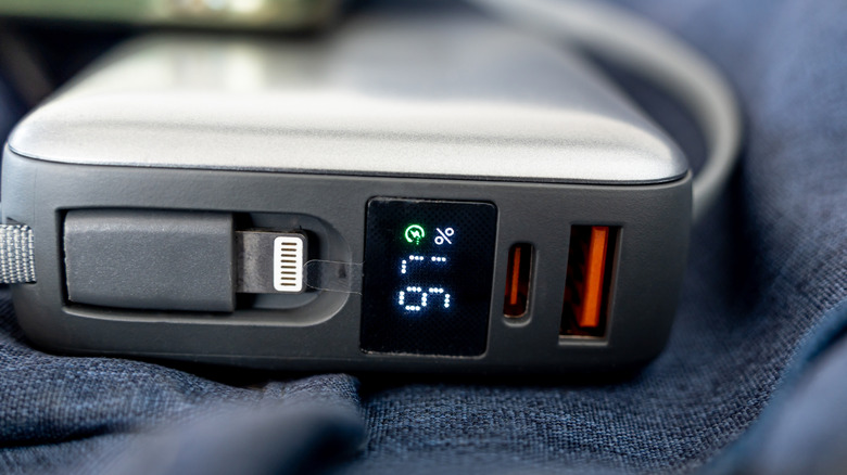 The front of a portable power bank showing charge status.