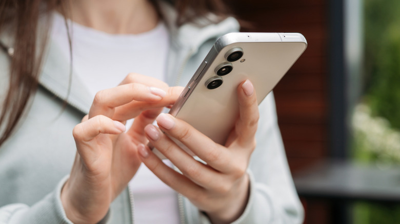 A person using a Samsung Galaxy phone
