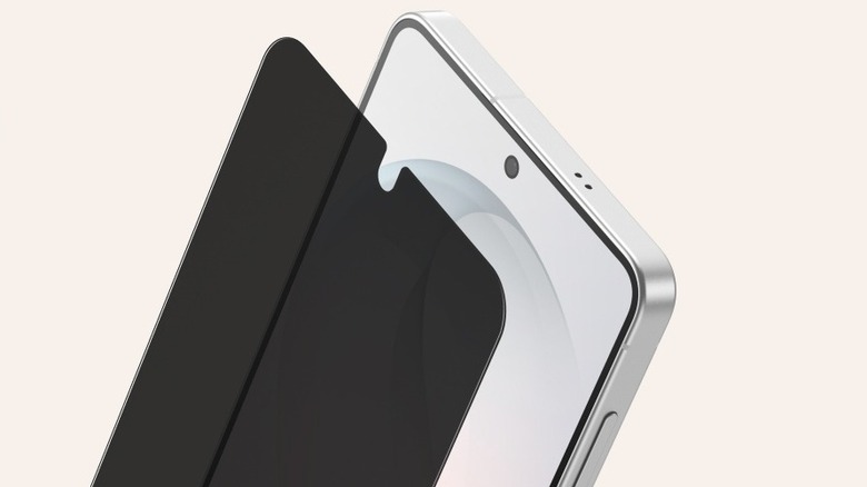 A Belkin privacy screen protector next to a Samsung Galaxy S26 smartphone
