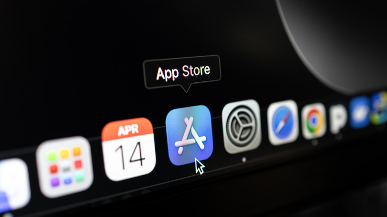 A MacBook closeup showing the doc with a mouse hovering over the App Store icon