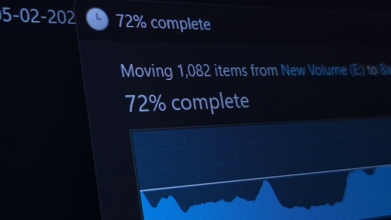a closeup of a computer screen displaying file transfer