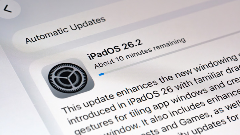 A close up of an iPad screen updating to iPadOS 26.2.