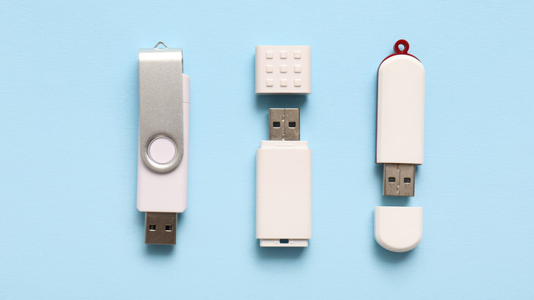 different usb drives next to each other on a light blue background