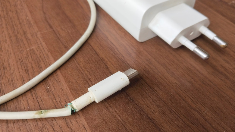 A phone charger with exposed wires