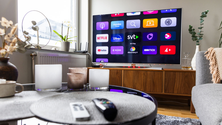 A Smart TV displaying apps in a living room space