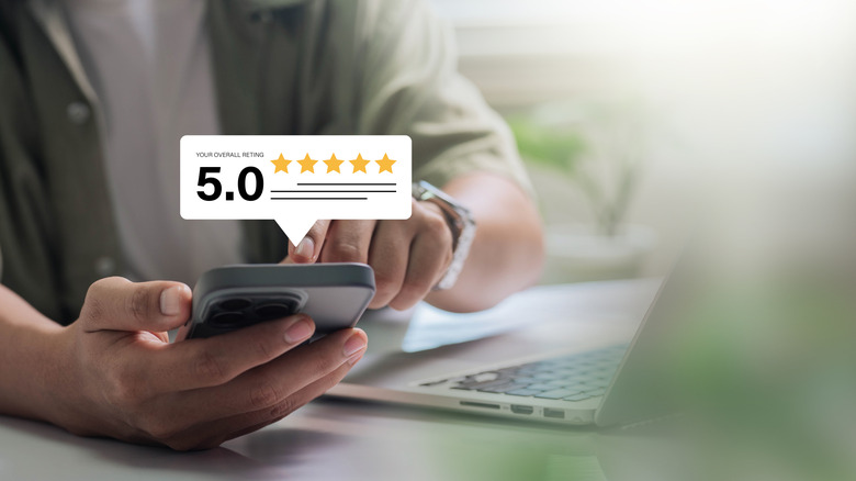 Concept image of a person viewing product rating on their smartphone