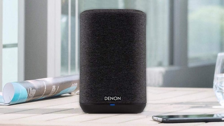 The Denon Home 150 Wireless Smart Speaker on a kitchen counter.