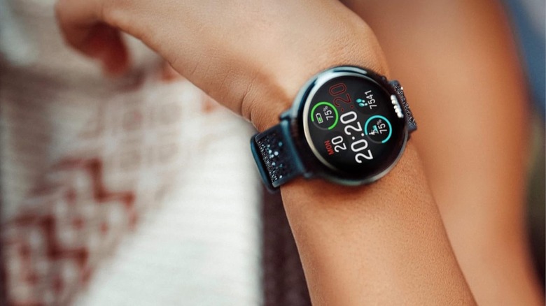 Polar Ignite 3 smartwatch worn on the wrist with tracking features visible.
