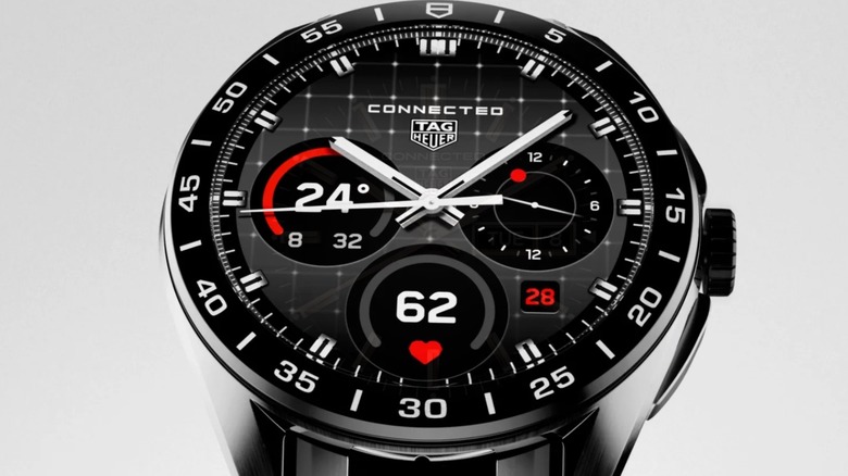 A TAG Heuer smartwatch against a gray background
