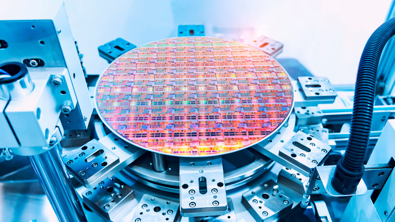 A wafer of computer chips inside a fabricator