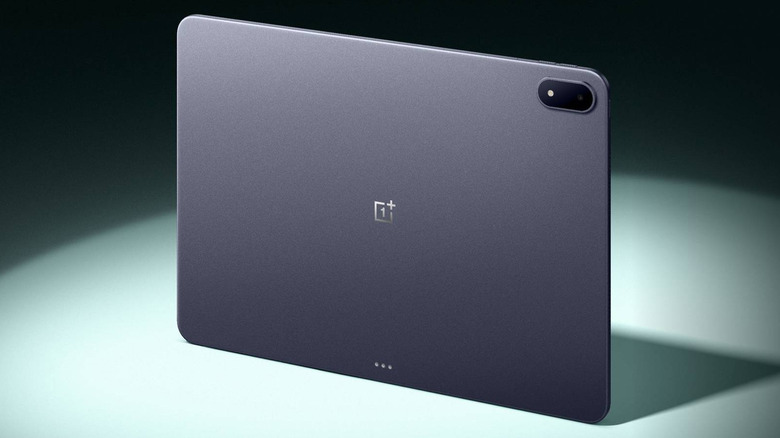 The back of the OnePlus Pad 3 standing on a table with a spotlight on it.