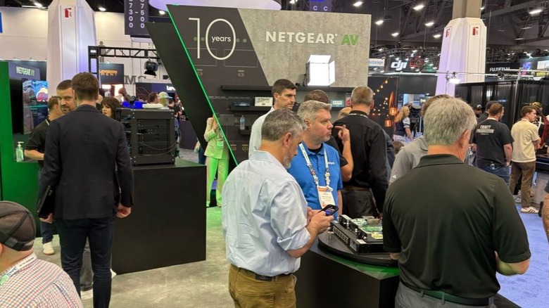 Netgear AV logo in the background at a trade show.