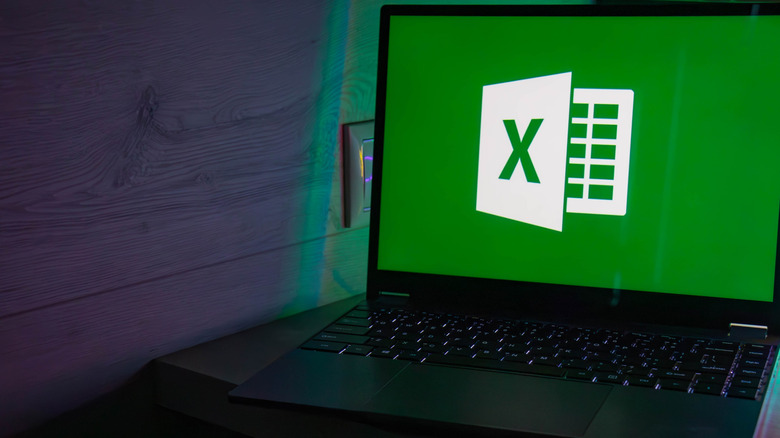 A laptop with a Microsoft Excel logo on the screen