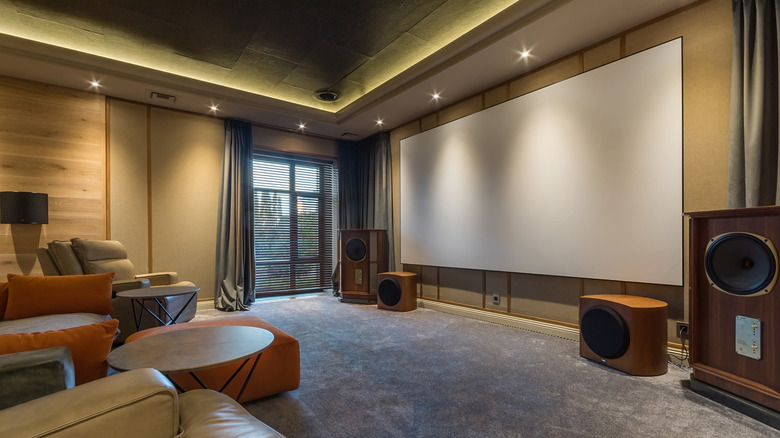 A home theater setup built around a projector and projector screen
