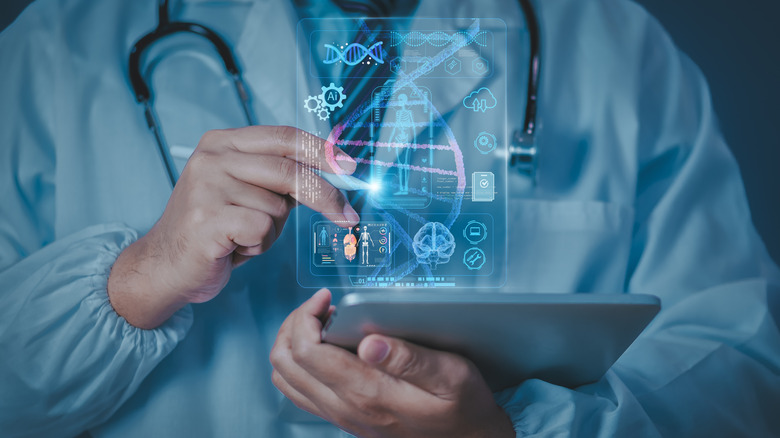Doctor using tablet with holographic display showing health data