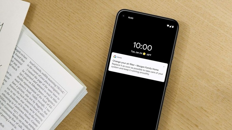 A smart thermostat filter reminder on a phone