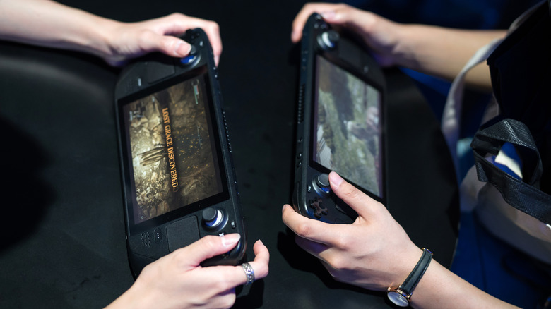 Two Steam Decks being played