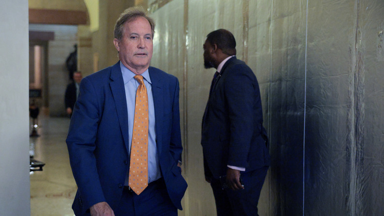 Texas Attorney General Ken Paxton walking down a hallway