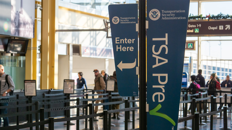 TSA PreCheck lanes at airport security checkpoint.