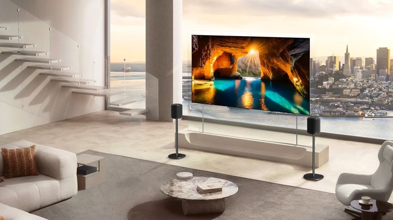 An LG OLED evo AI W6 impossibly thin smart TV is mounted in a modern setting.