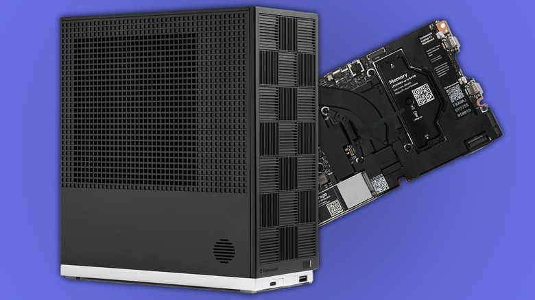 Framework Desktop with mainboard behind it