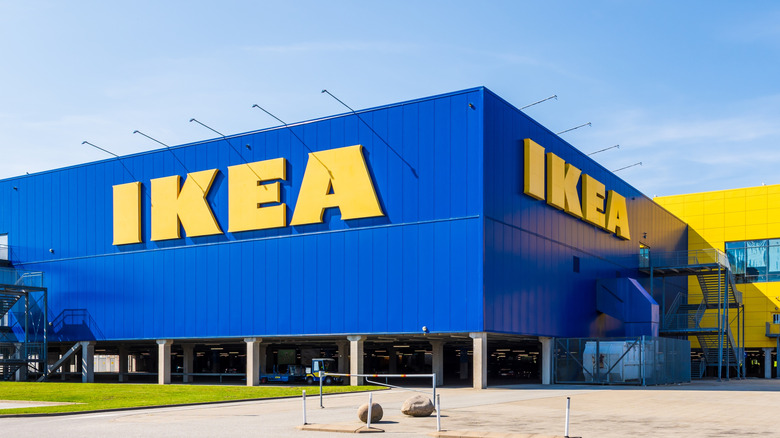 Large IKEA signs on the blue facade of an IKEA store