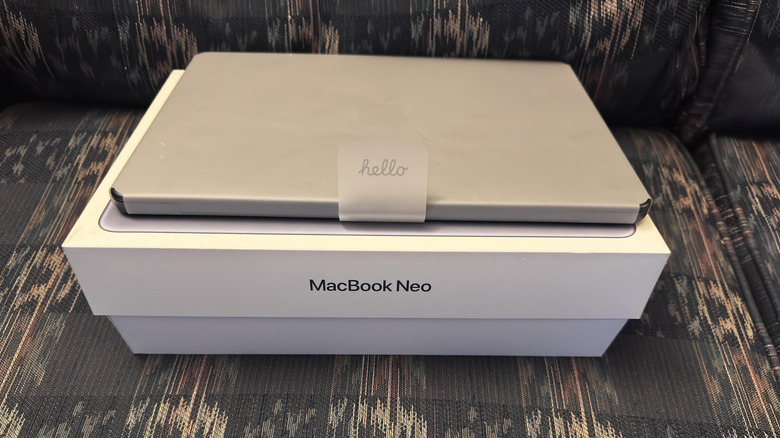 A brand-new MacBook Neo placed on its packaging