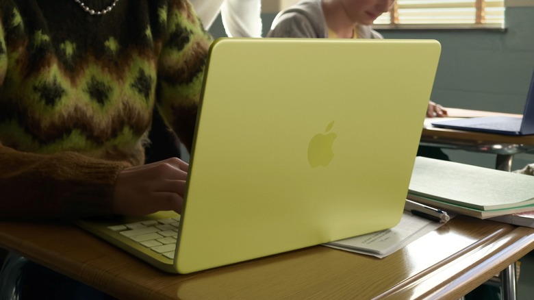 A student using the Apple MacBook Neo in a classroom