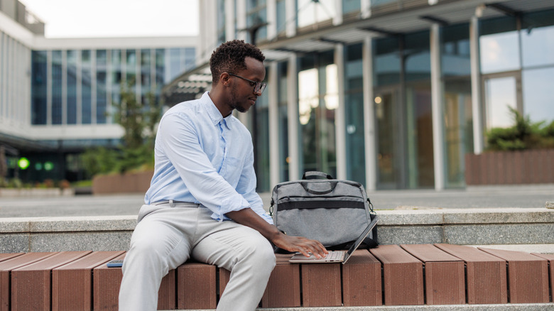 Working on a laptop in a public area