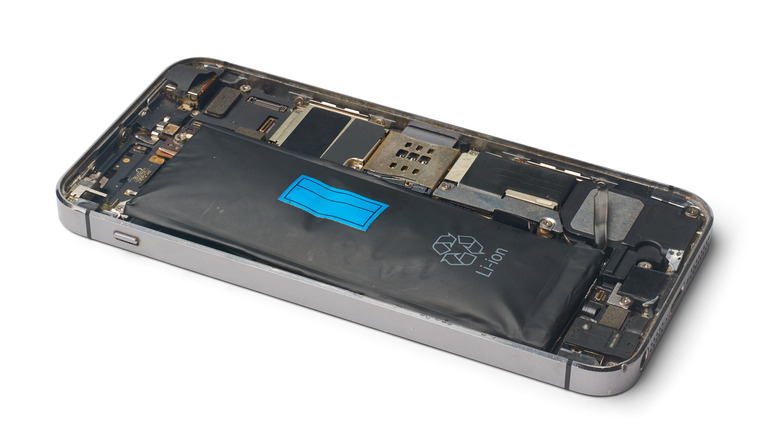 An opened iPhone with an exposed battery.