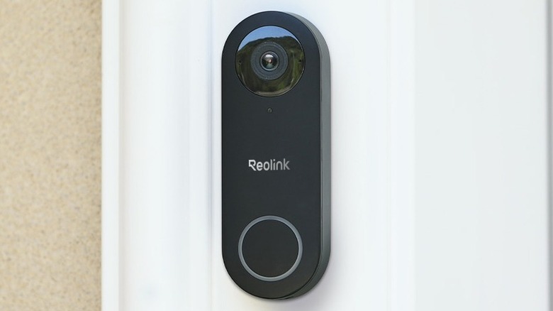 The Reolink Video Doorbell PoE mounted on the exterior of a house