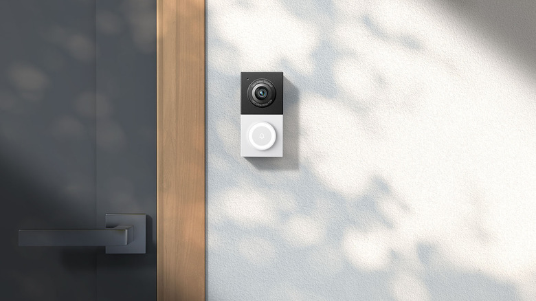 The TP-Link Tapo D130 mounted to a wall outside a house