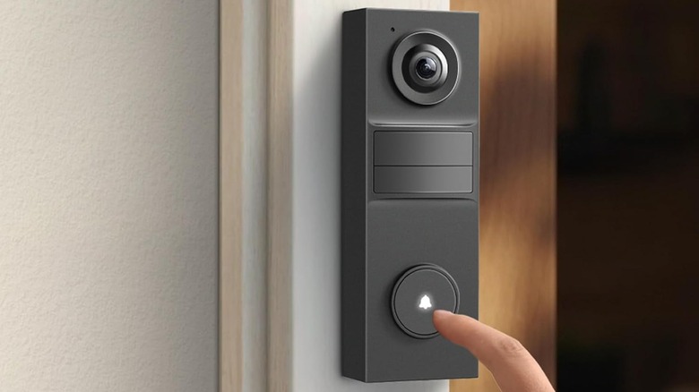 A person ringing the Tapo 2K Wireless Video Doorbell