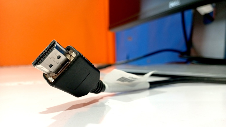 HDMI cable on table next to computer monitor